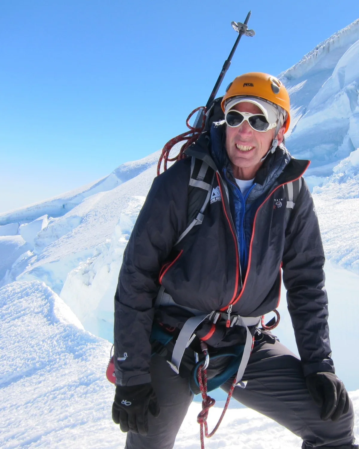 Craig Van Hoy wearing climbing gear on a glacier